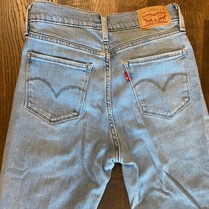 Levi’s 724 distressed high rise light wash jeans